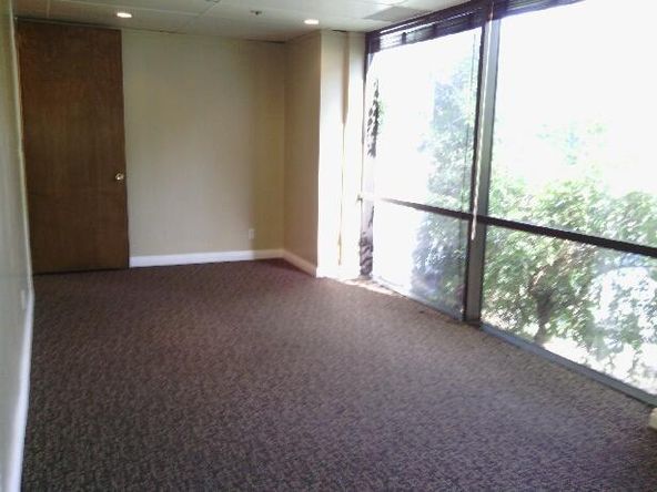 Ground floor office with beautiful tile entry and reception. Several uses.